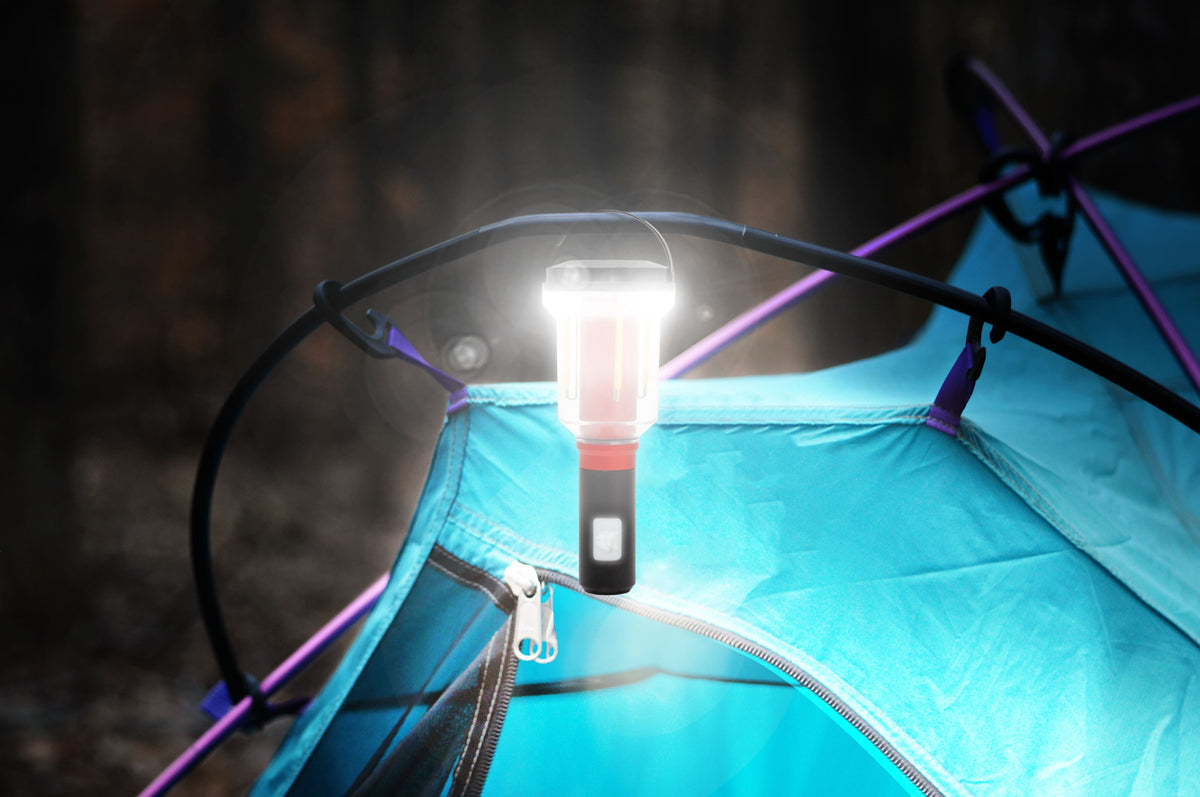Camping tent with a FLi-MORPH light head attached, set against a dark background