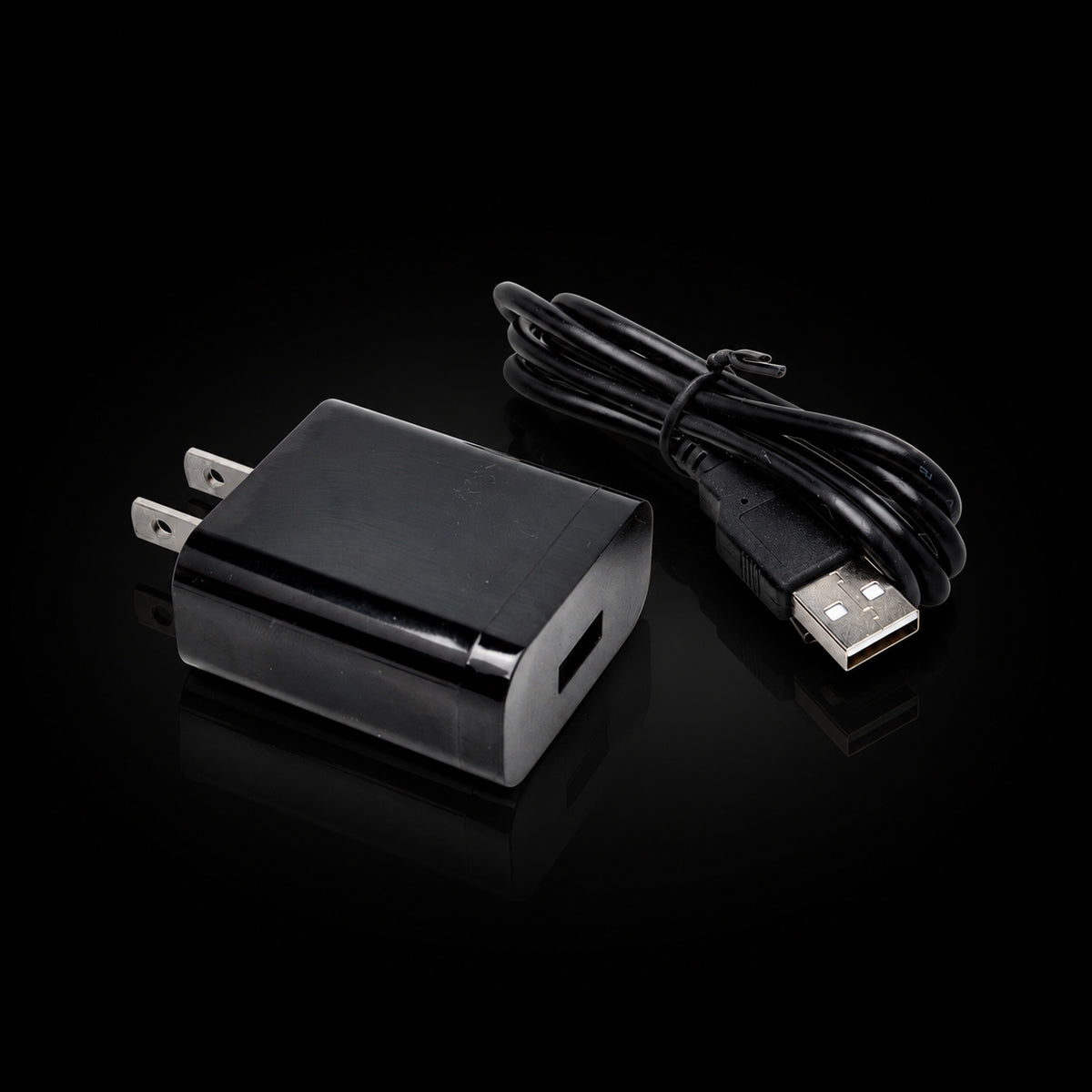 Micro USB cable with wall power adapter on black