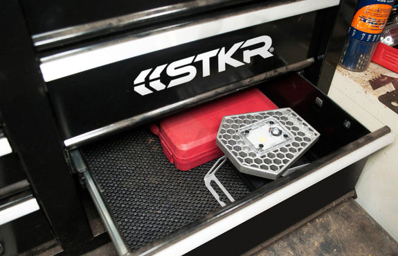 The Mobile Task Light compact design showing it sitting in a tool box's bottom drawer